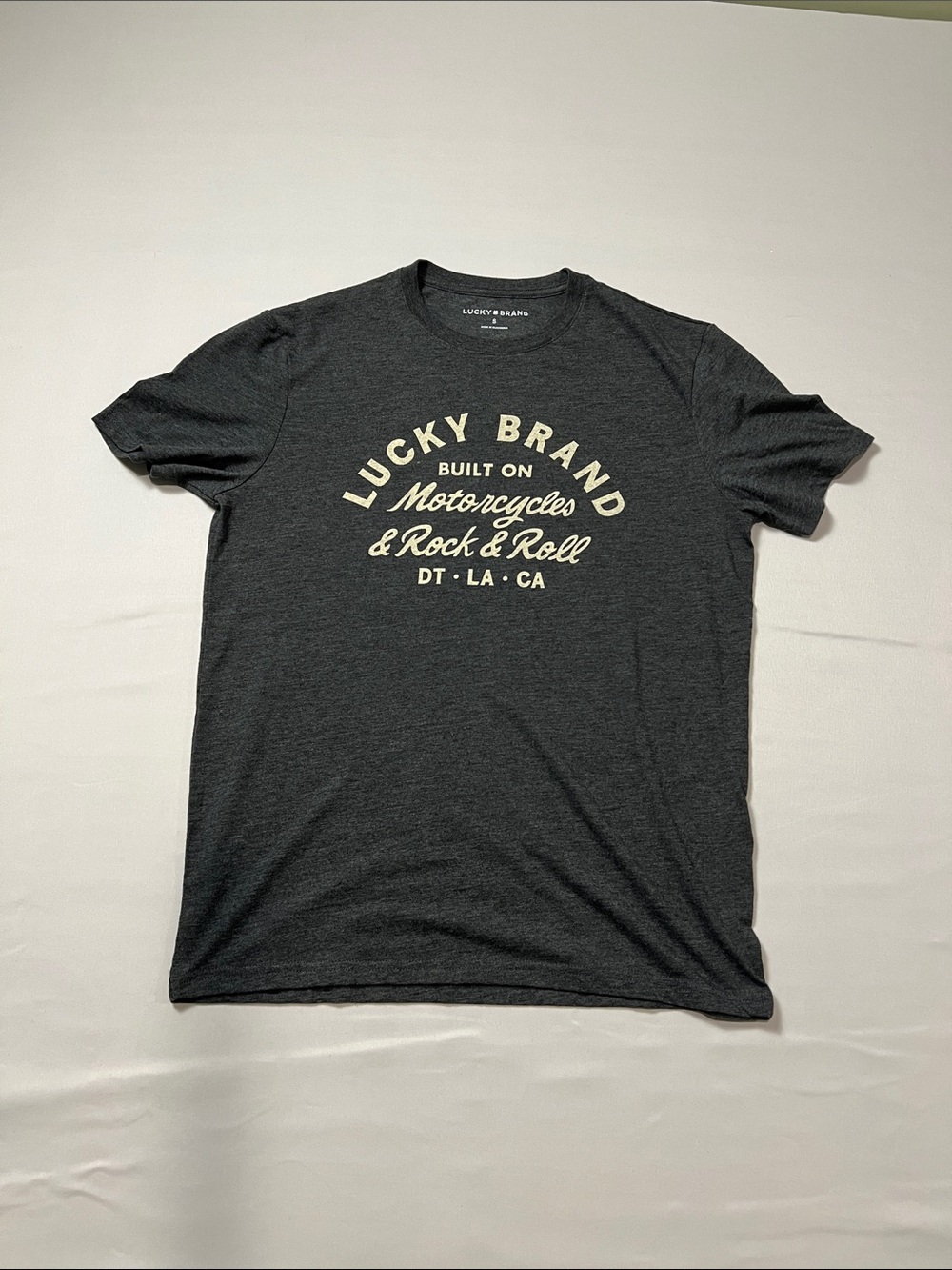 Lucky Brand Men's Charcoal Gray Graphic Tee with Cream Script Size S
